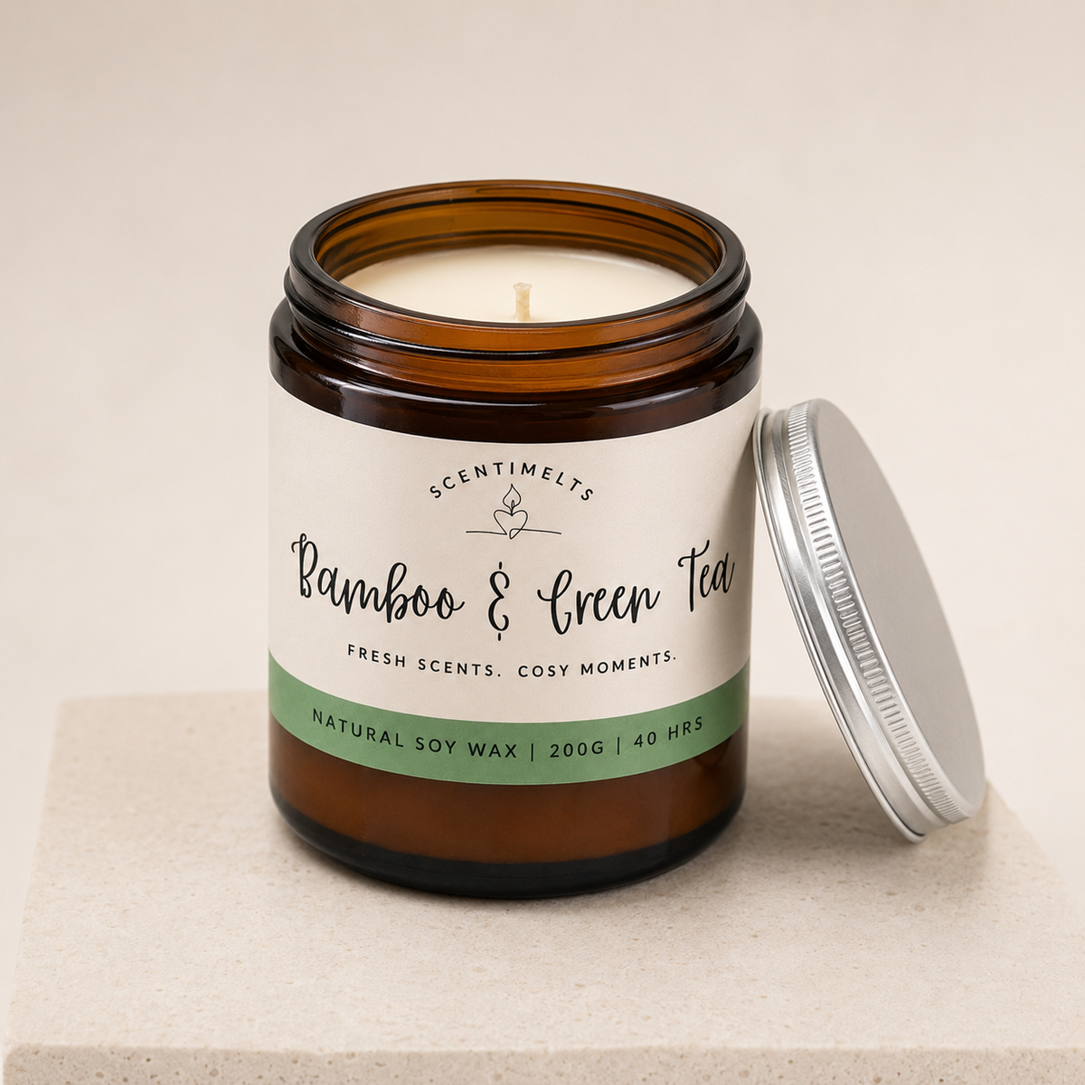 Candle in a glass jar with a label on a beige background