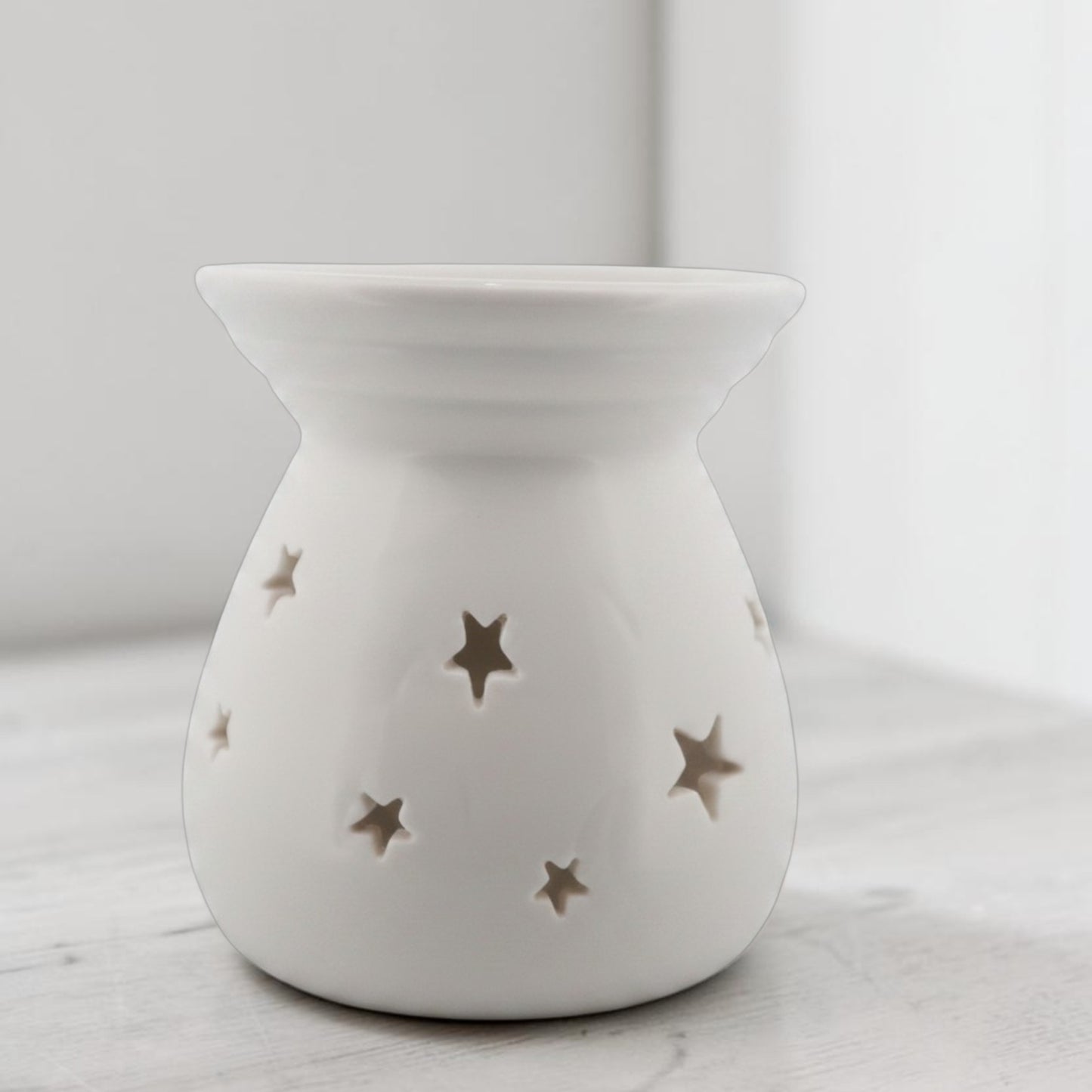 White ceramic wax melt burner side view showing top dish and tealight chamber