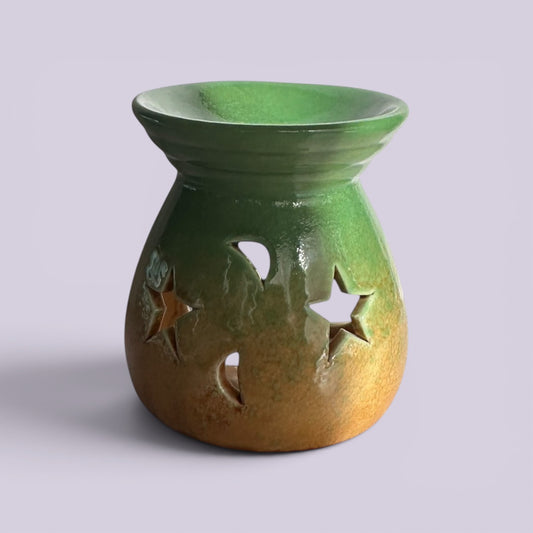 Citrus Garden ceramic tealight burner in green to amber glaze with star and moon cut-outs