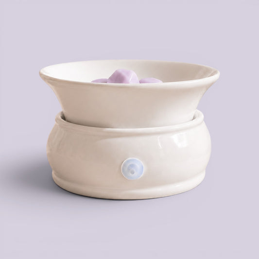 Minimalist White Electric Warmer in cream glaze with lilac melts in the flared dish