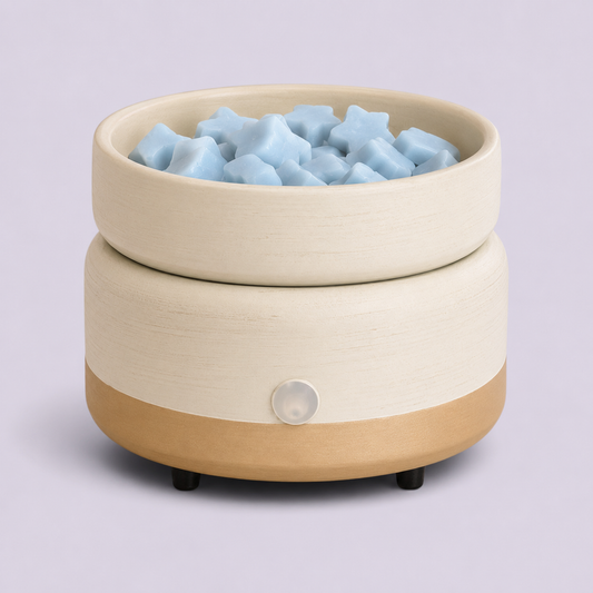 Soft Sage Electric Warmer with blue star-shaped wax melts in the removable top dish