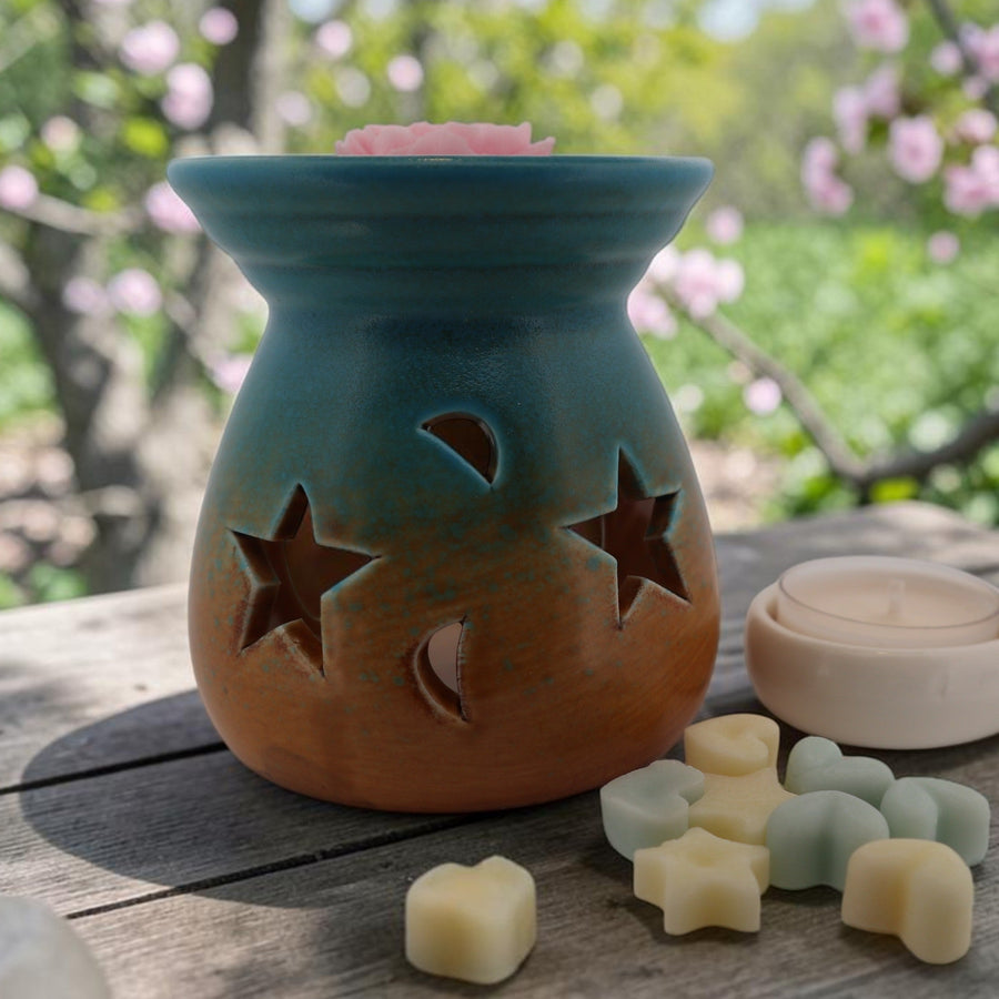 Azure Bloom ceramic wax melt burner outdoors with wax melts and a white tealight holder